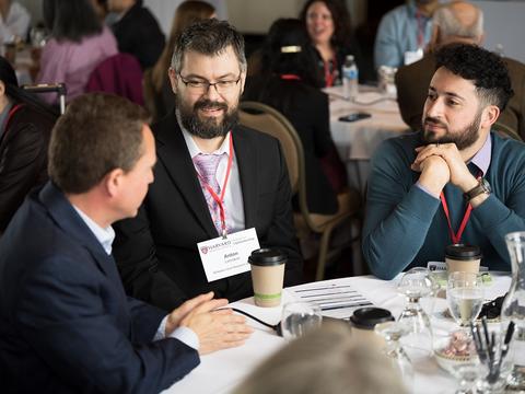 Faculty in conversation at the retreat